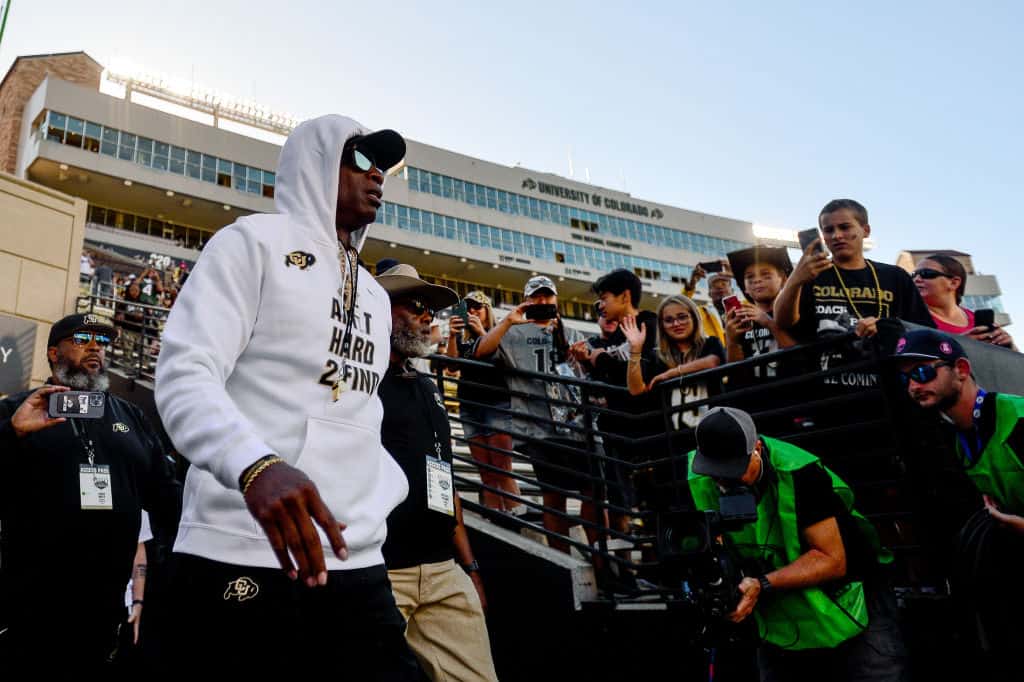 Head coach Deion Sanders of the Colorado Buffaloes walks onto the field before a game against the Nebraska Cornhuskers at Folsom Field on September 9, 2023 in Boulder, Colorado.