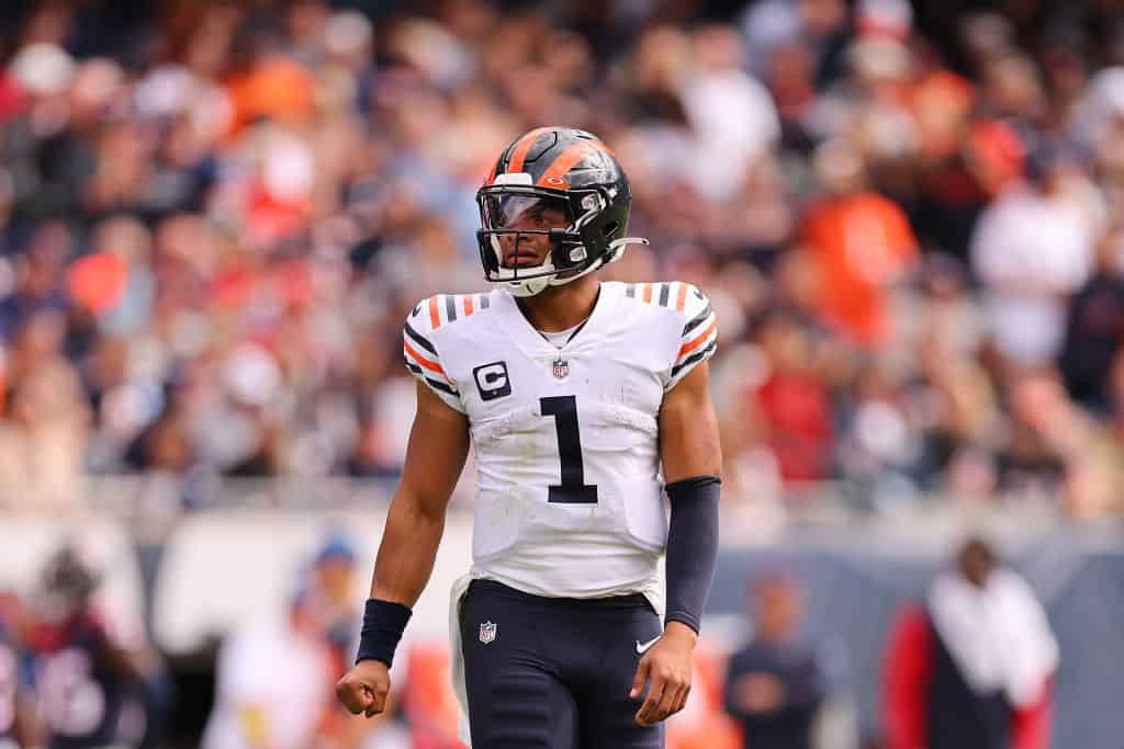 Justin Fields #1 of the Chicago Bears reacts against the Houston Texans at Soldier Field on September 25, 2022 in Chicago, Illinois.